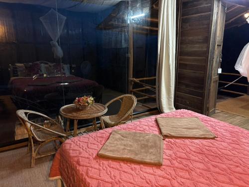 Postel nebo postele na pokoji v ubytování สะปันซีวิว ที่พักบ้านสะปัน บ่อเกลือ น่าน