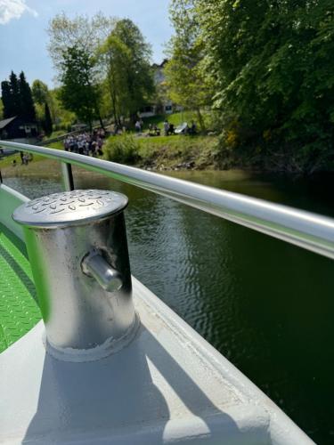 a metal pole on a bridge over a body of water at #8 Ommi Kese See-Suite FD Sauna Hund Terrasse in Olpe