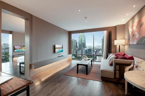 Postel nebo postele na pokoji v ubytování Sivatel Bangkok Hotel