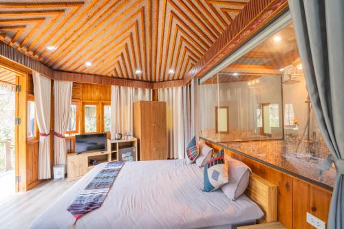 Ένα ή περισσότερα κρεβάτια σε δωμάτιο στο Sinai Bungalow & Hotel SaPa