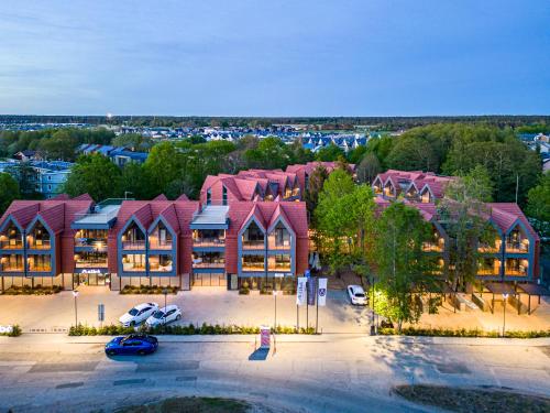 an aerial view of a large building with a parking lot at Hill Palanga & SPA in Palanga