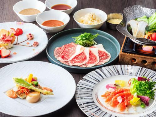 a table with plates of food and bowls of food at Hakone Sengokuhara Prince Hotel in Hakone