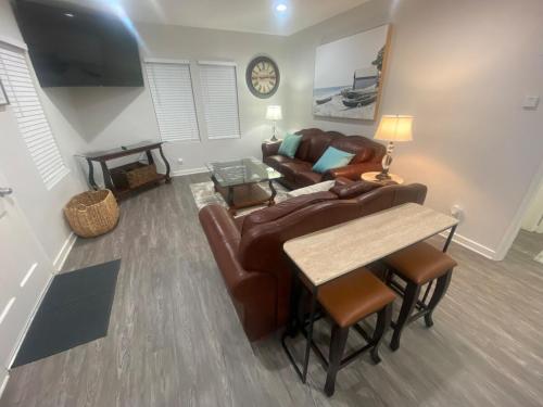 a living room with a couch and a table at BonVoyage-Sleep&Sail Overnight Stays-Sleeps 6-8 in Long Beach
