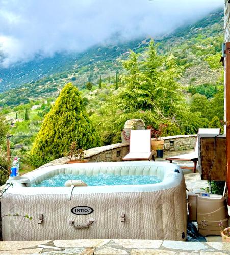 a hot tub with a view of a mountain at Rock Dandy Deluxe Chalet in Arachova - Delphi, Sauna, Prv Parking, Amazing View in Arachova