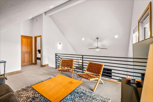 a living room with two chairs and a table at Dover Bay in Dover