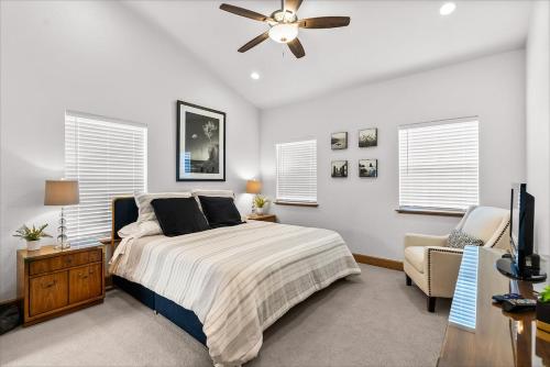 a bedroom with a bed and a ceiling fan at Dover Bay in Dover