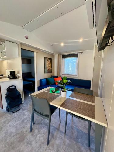 a living room with a table and a couch at Camping-Village del Sole in Cannobio