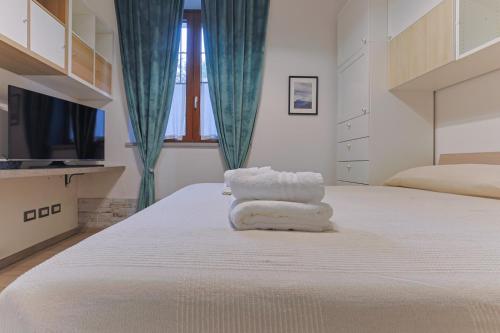 Postel nebo postele na pokoji v ubytování OttoHouse Fiera Milano