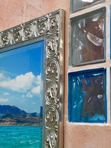 a picture of a window with a view of the water at Summer Wind Apartments in Trapani