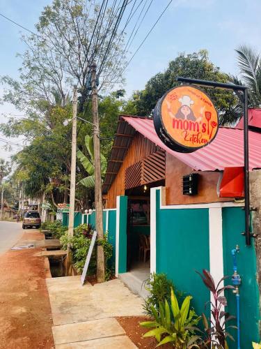 a restaurant with a sign on the front of it at Alass Ga For Pets Lovers in Trincomalee