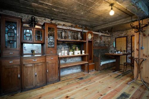 a room with wooden cabinets and a table in a house at The Victorian Hotel & Spa Room 3 in Yerevan
