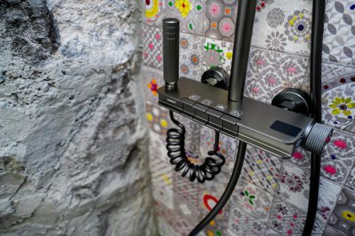 a phone hanging on a wall at The Victorian Hotel & Spa Room 3 in Yerevan