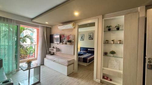 a living room with a couch and a window at seven sea F508 in Jomtien Beach