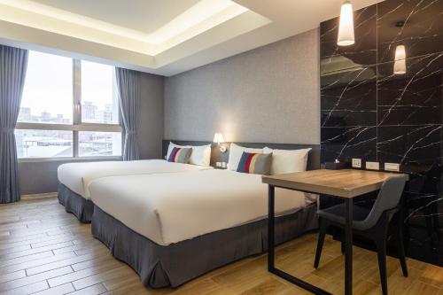 Postel nebo postele na pokoji v ubytování CHECK inn New Taipei LuZhou
