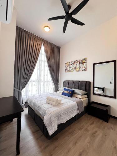 a bedroom with a bed and a ceiling fan at MySky Stays Putrajaya in Putrajaya