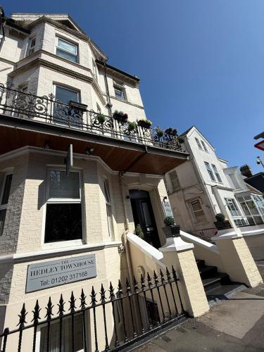 a building with a sign in front of it at The Hedley Townhouse in Bournemouth