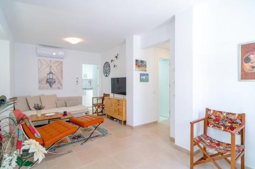 a living room with a couch and a table at Casa Alegre by Casasol in Nerja