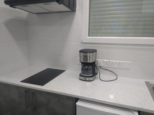 Kuchyň nebo kuchyňský kout v ubytování Ermioni Apartments