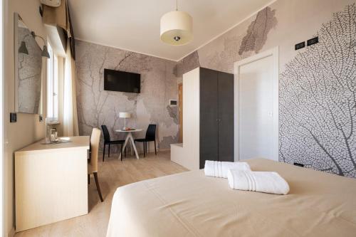 Ένα ή περισσότερα κρεβάτια σε δωμάτιο στο Hotel Mondial