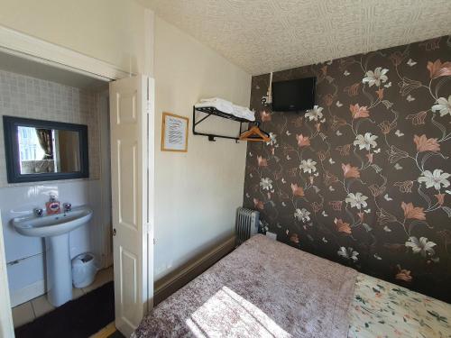 Katil atau katil-katil dalam bilik di Windsor House Hotel