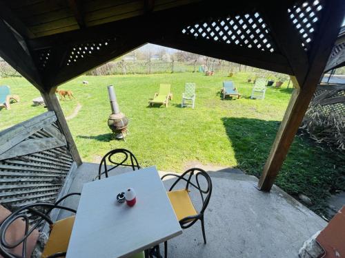 a white table and chairs on a patio at GreenPark Garden Villa Family Apartments Near Tokaj in Szerencs