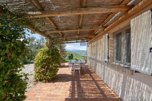 a patio with a table on the side of a house at La Bella Addormentata in Castilenti