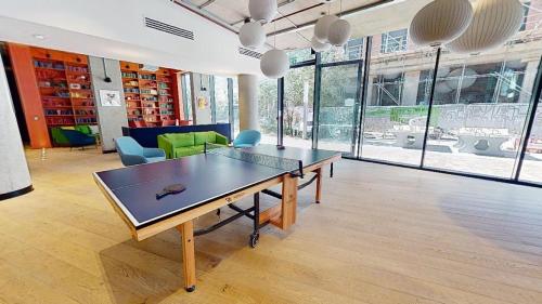 a room with a table and chairs and windows at For Students Only at iQ Brighton in Brighton & Hove