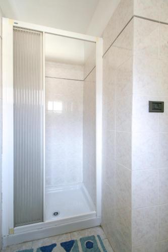 a shower with a glass door in a bathroom at La Ghiacciaia in Verzuolo