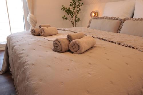 a bedroom with two beds with towels on them at Ferienhaus Unter der Burg in Gerolstein