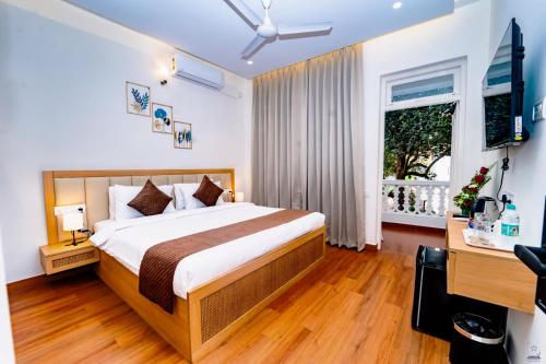 Postel nebo postele na pokoji v ubytování Maashpi Hotel & Resort, Candolim