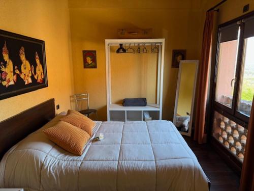 a bedroom with a large bed in a room at Podere Boschetto R&B in Bologna