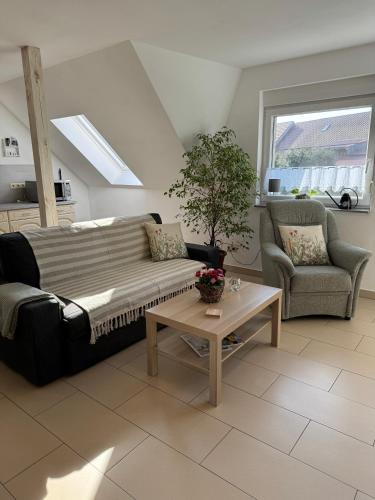 a living room with a couch and a table at Gemütliches Appartment in Tucheim in Tucheim