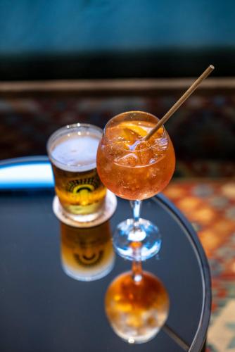 two glasses of beer sitting on a table at Motel One Copenhagen in Copenhagen