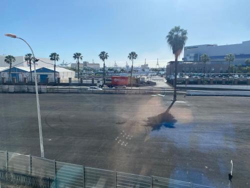 a person is standing in a parking lot at Lucy lux apartament in Las Palmas de Gran Canaria