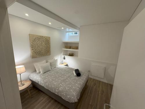 Postel nebo postele na pokoji v ubytování Residencial Neves