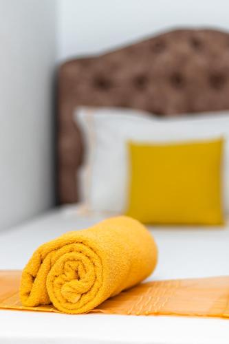 a yellow towel sitting on top of a table at Le Rooftop Apparte - Barbecue, Grande Terrasse in Nabeul