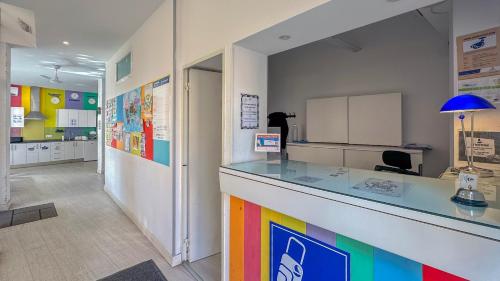 a room with a counter with a rainbow at Palma Port Hostel - Albergue Juvenil in Palma de Mallorca