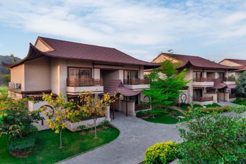 an image of a house with a garden at Ananta Spa & Resort Jaipur in Jaipur