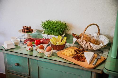 a buffet with eggs and other food on a table at Apartment House Ančkin kot in Cerknica