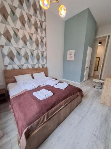 Postel nebo postele na pokoji v ubytování Nebula Boutique Hotel