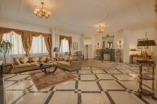 a large living room with couches and a fireplace at Sonesta Hotel Tower & Casino Cairo in Cairo