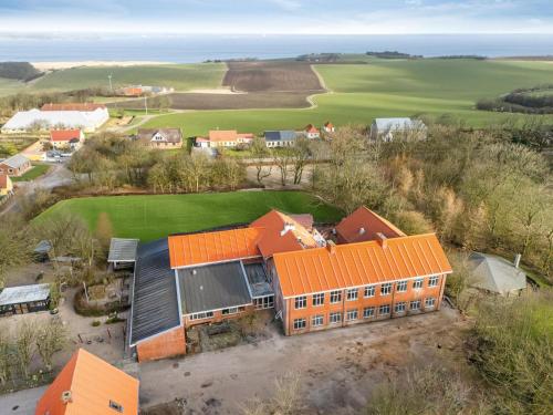 an aerial view of a house with an orange roof at Large Pool House With 15 Bedrooms And Lots Of Activity Options in Erslev
