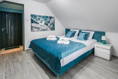 Postel nebo postele na pokoji v ubytování Pokoje, Apartamenty, Domki nad Morzem Dune Resort Łeba