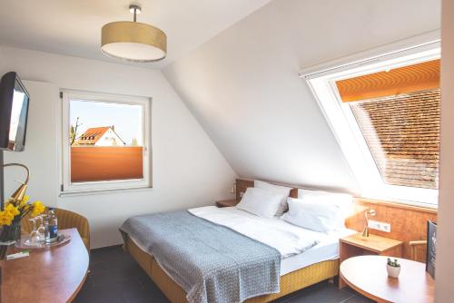 Postel nebo postele na pokoji v ubytování Gästehaus Inselhof