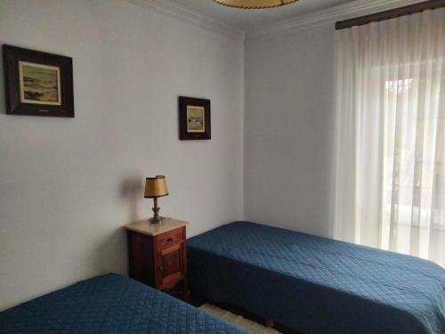 Postel nebo postele na pokoji v ubytování Casa Xantarim