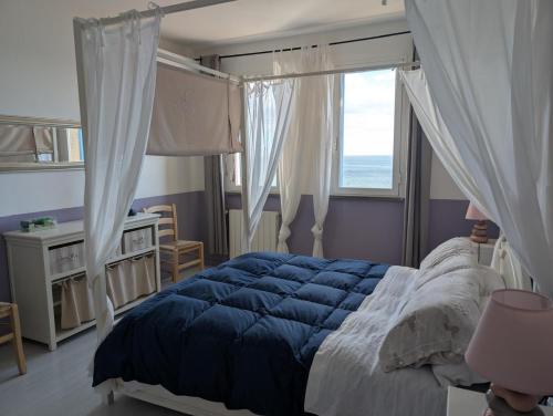 Postel nebo postele na pokoji v ubytování Azzurra Salivoli by VacaVilla