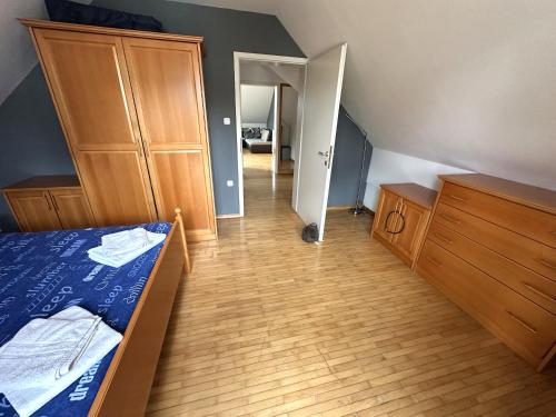 a bedroom with a bed and a wooden floor at Apartment Emona Bled 4 in Bled