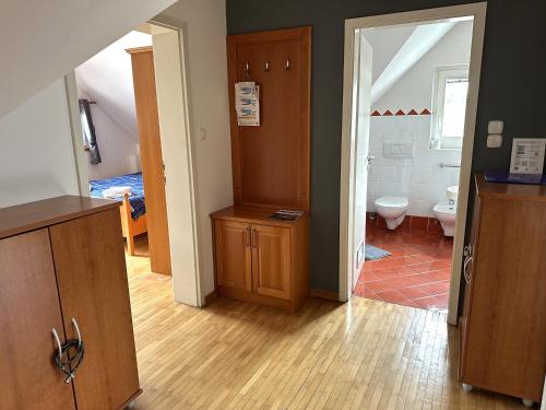 a room with a bathroom with a toilet and a sink at Apartment Emona Bled 4 in Bled