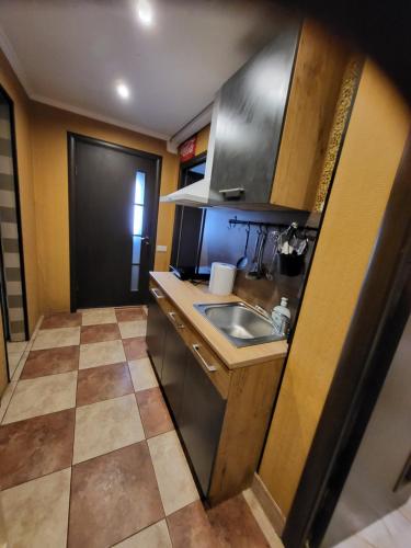 O bucătărie sau chicinetă la Classic Apartment