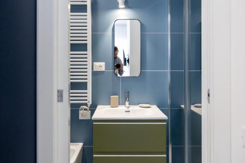 a bathroom with a sink and a mirror at Amarena Vacanze in Porto Recanati